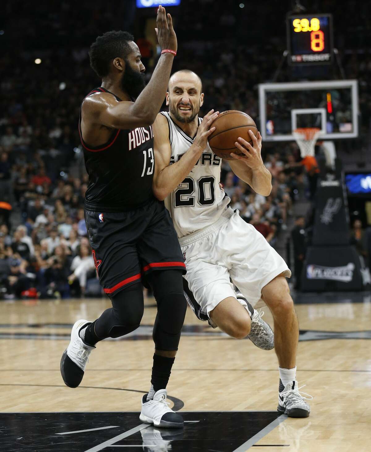 Spurs' Manu Ginobili (20) drives on Houston Rockets' James Harden (13) in Game 5 of the Western Conference semifinals at the AT&T Center on Tuesday, May 9, 2017. (Kin Man Hui/San Antonio Express-News)