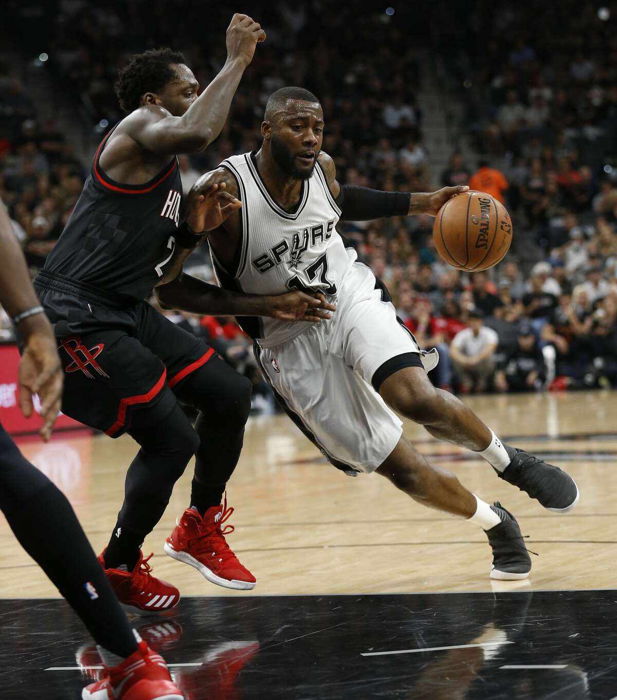 Spurs' Jonathon Simmons (17) drives on Houston Rockets' Patrick Beverley (02) in Game 5 of the Western Conference semifinals at the AT&T Center on Tuesday, May 9, 2017. (Kin Man Hui/San Antonio Express-News)