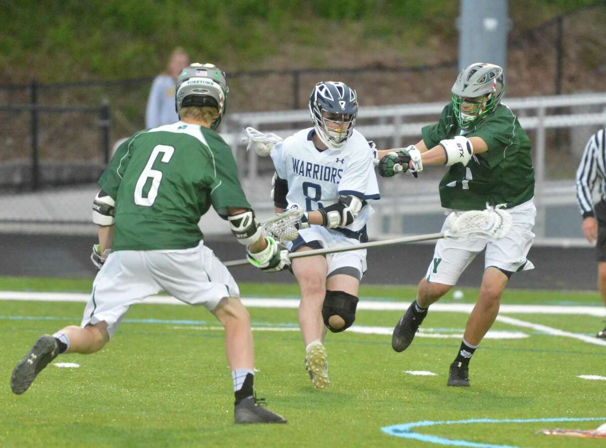 Wilton’s Kieran McGovern heads up the field against Yorktown in Tuesday’s game.