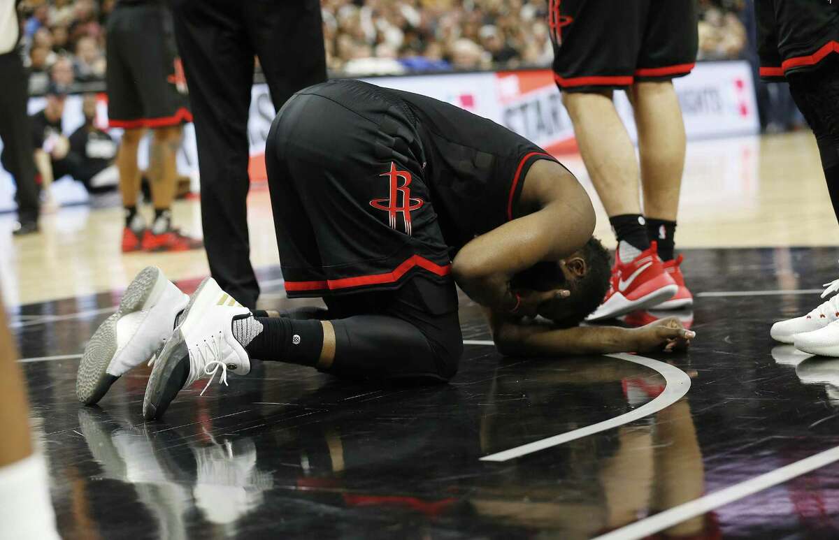 Houston Rockets’ James Harden lies on the floor after getting fouled during Game 5 of the Western Conference semifinals against the Spurs at the AT&T Center on May 9, 2017.
