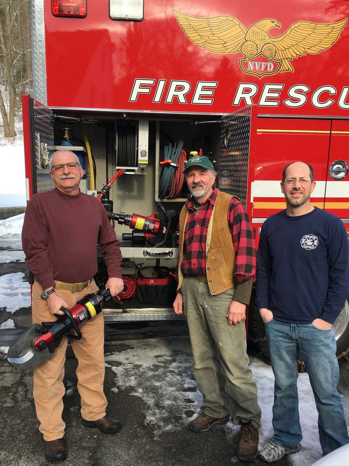 The Northville Volunteer Fire Department has received a grant from the Ellen Knowles Harcourt Foundation for the purchase of vehicle extrication equipment. Fire Chief Alan Harris, left, joins Bob Nicholas of the foundation, middle, and grant writer John Kuck.