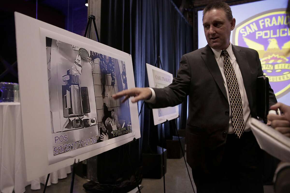 San Francisco Police Commander Greg McEachern, points out a photo of the suspect taken from the Subway camera overhead as San Francisco's Chief of Police William "Bill" Scott holds a town hall, on Wednesday May 10, 2017, to discuss last week's fatal police shooting of a 26-year-old stabbing suspect along Market St. in downtown San Francisco, Ca.