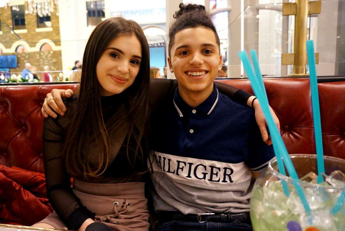 15-year-old Jayson Negron, left, celebrates with his half-sister Jazmarie Melendez on her birthday this past March.