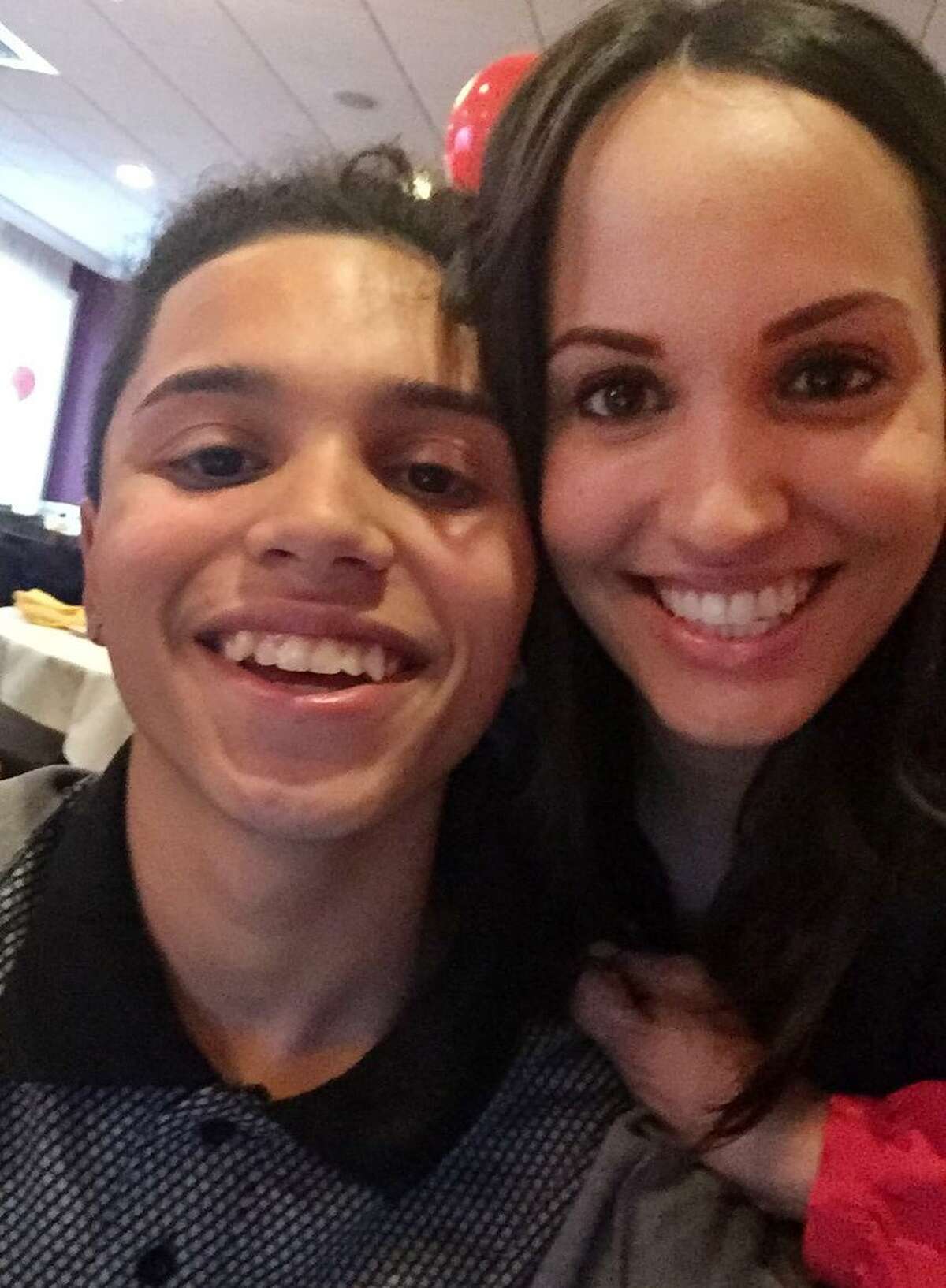15-year-old Jayson Negron with cousin Cheryl Green. Relatives have identified Negron, of Bridgeport, as the teen shot dead by police on Tuesday.