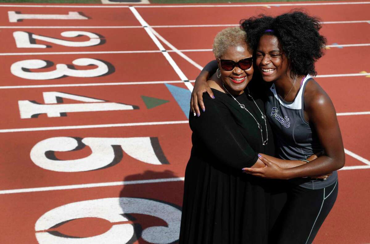 Humble sprinter Arianna West and her grandmother Barbara Smith rejoice on the Turner Stadium track. West leaned on Smith for support after her mother died last July from lupus.﻿