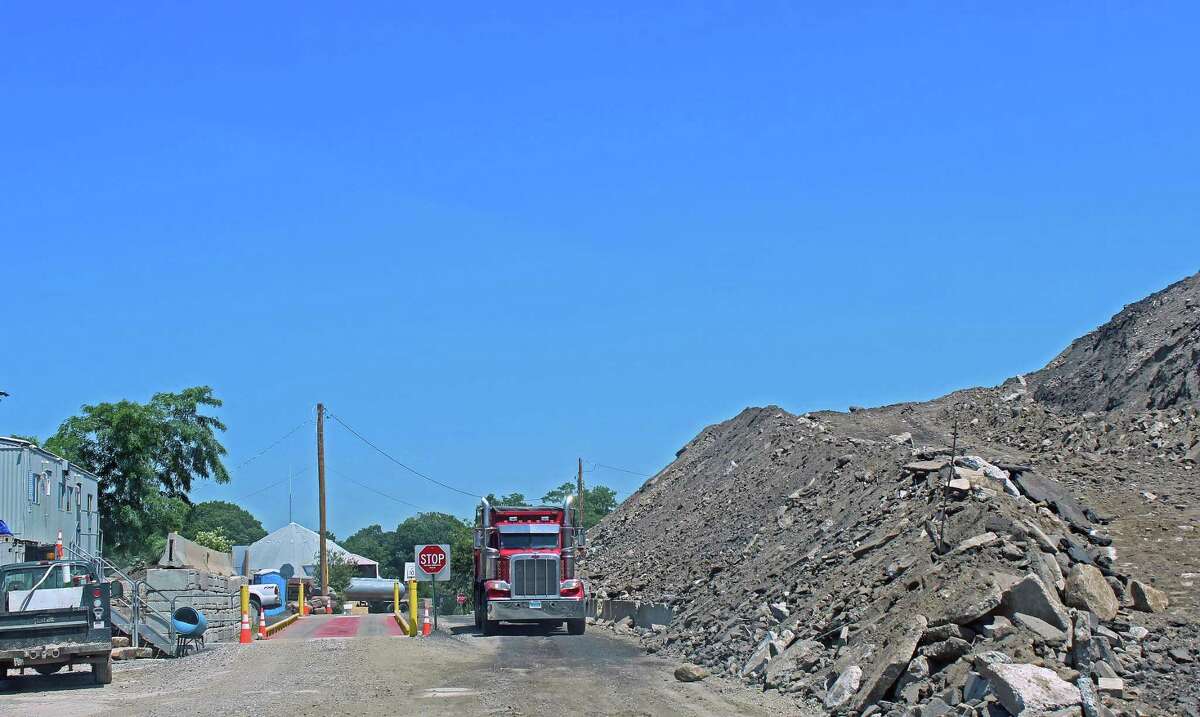 The town has filed suit against Julian Development for its failure to reduce the fill pile at One Rod Highway.