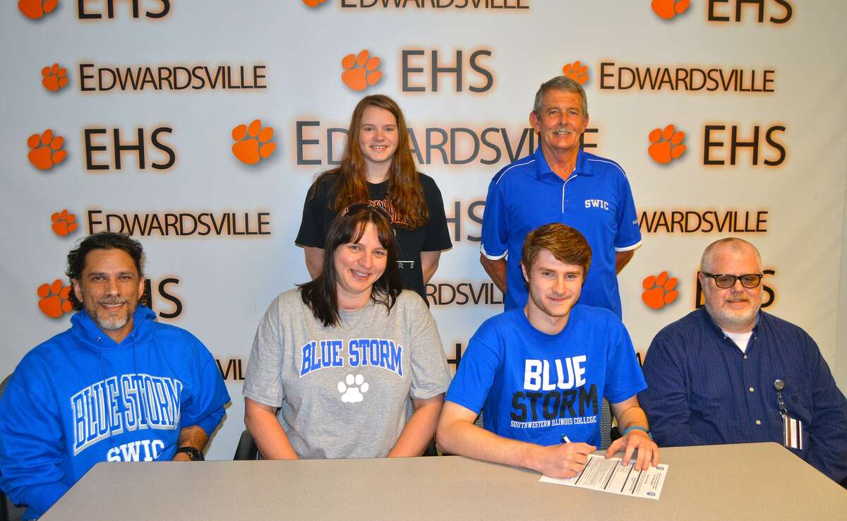 Oliver Stephen, seated second from right, will play college basketball at SWIC.