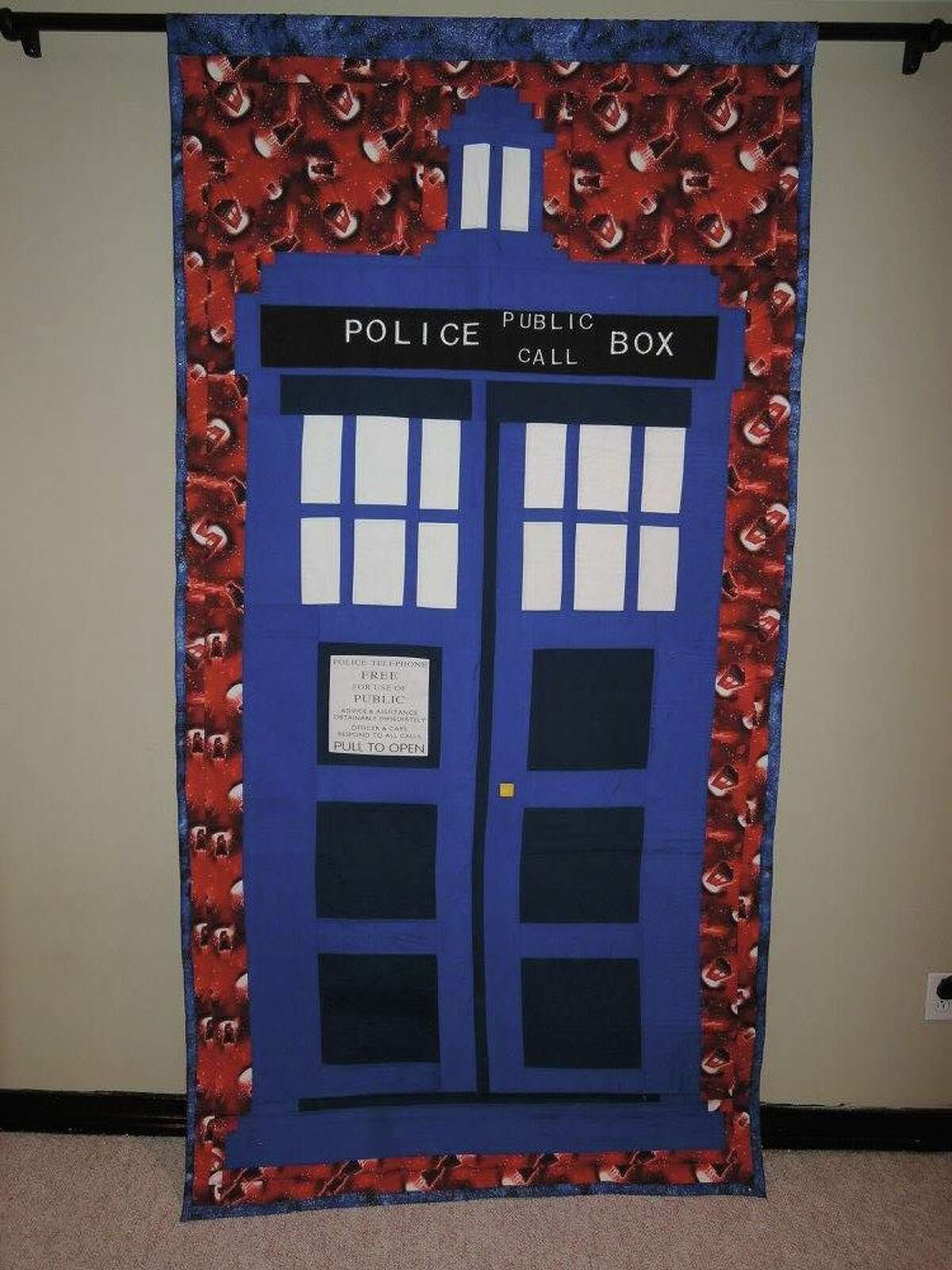 Andi Hamilton is a Houston resident and accountant who spends her spare time making quilts with science fiction and video game motifs including images from Doctor Who, Star Wars, Ghostbusters, Super Mario and more
