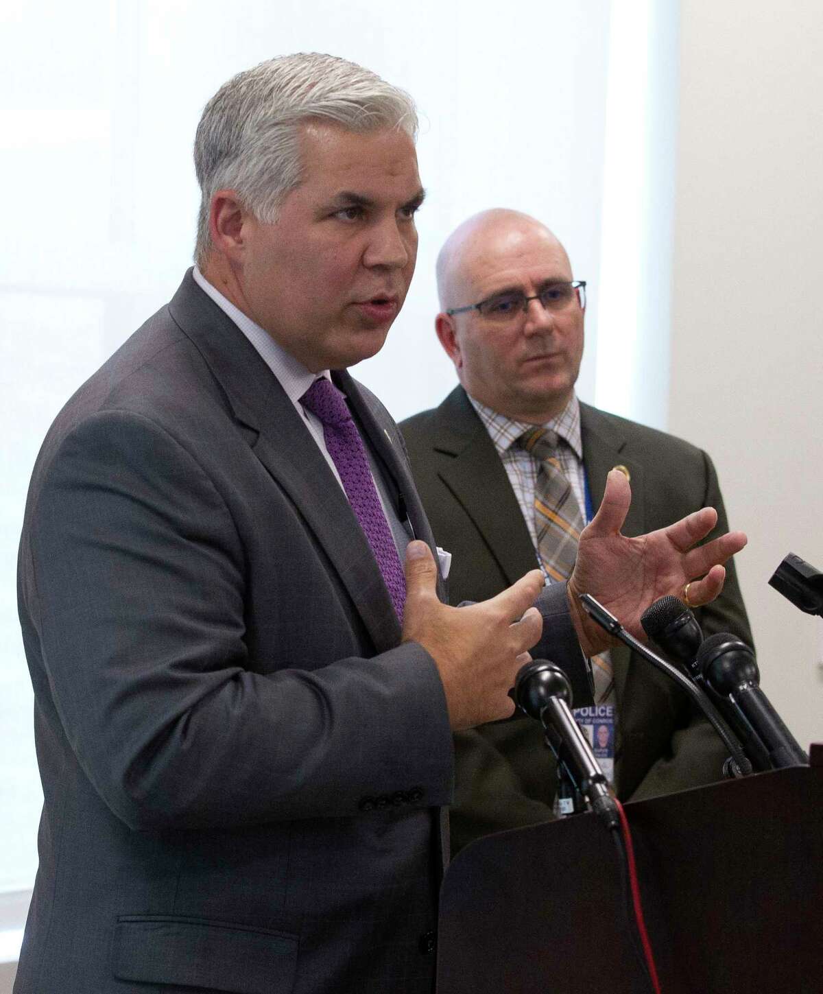 Montgomery County District Attorney Brett Ligon speaks beside Conroe Police Chief Philip Dupuis during a press conference where the body camera video from a shooting involving Conroe police officer Greg Vradenburg was released Thursday, May 11, 2017, in Conroe. Christopher Ryan Hatton, 28, shot at Vradenburg following a traffic stop in January 2016. Hatton was convicted of first-degree felony aggravated assault of a public servant in 40 minutes gave him a 99-year sentence and a $10,000 fine. Hatton will not be eligible for parole until he is 58.