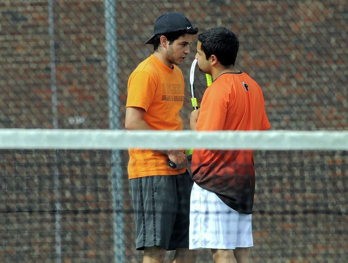 Stamford doubles players Mike Rosinski and Federico Marin chat between point during the tennis match against Westhill doubles team of Nikhil Arora and Kunai Butra on May 11, 2017. The Viking dou defeated their opponents 8-7 in a Pro Set game played at Stamford High School.