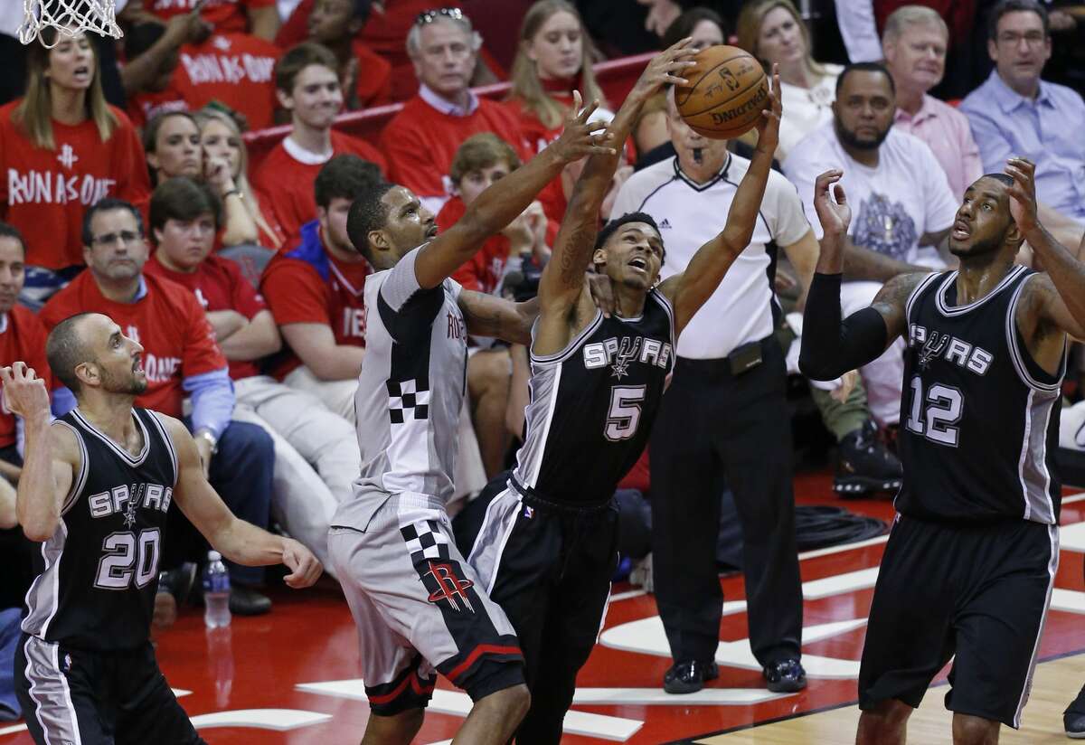 San Antonio Spurs' Dejounte Murray and Houston Rockets?• Trevor Ariza grab for a rebound as San Antonio Spurs' Manu Ginobili and LaMarcus Aldridge look on during second half action of Game 6 in the Western Conference semifinals held Thursday May 11, 2017 at the Toyota Center in Houston,Tx.