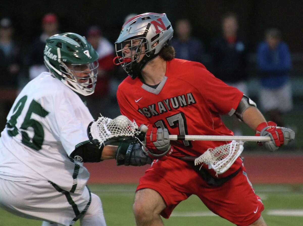 Niskayuna's Lucas Quinn advances the ball under pressure from Shen's Will Hubschmitt during the Suburban Council varsity lacrosse matchup Thursday, May 11, 2017 at Shenendehowa High School. (Ed Burke photo - Special to The Times Union)