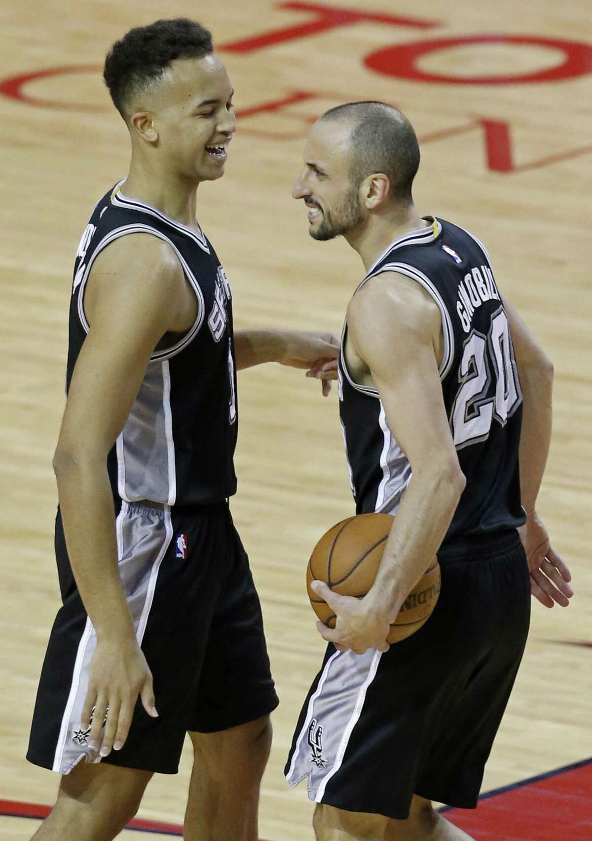 Spurs’ Kyle Anderson (left) and Manu Ginobili react after a play during second half action of Game 6 against the Rockets in the Western Conference semifinals on May 11, 2017 at the Toyota Center in Houston.