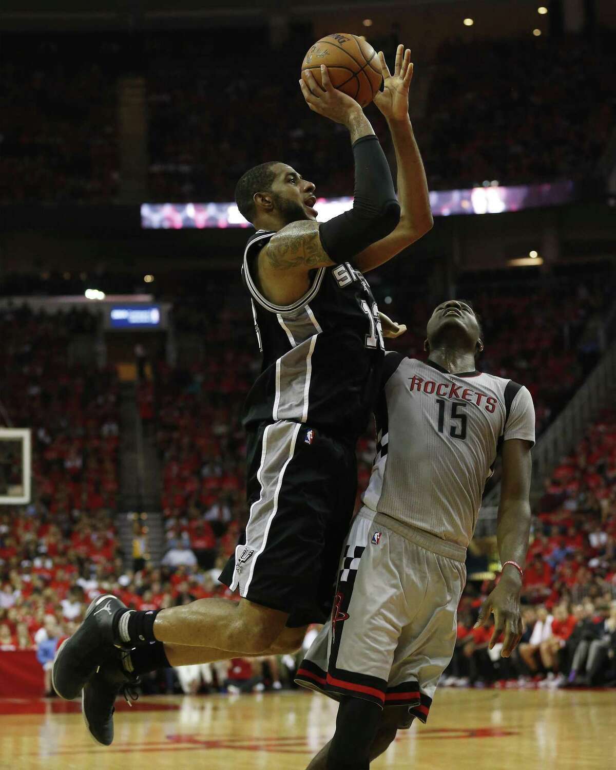 Spurs' LaMarcus Aldridge (12) attempts a shot against Houston Rockets' Clint Capela (15) in Game 6 of the Western Conference semifinals at the Toyota Center on Thursday, May 11, 2017. (Kin Man Hui/San Antonio Express-News)