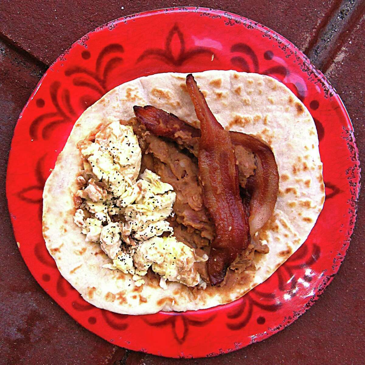 Bacon, egg and bean taco on a handmade flour tortilla from Eddie's Taco House.