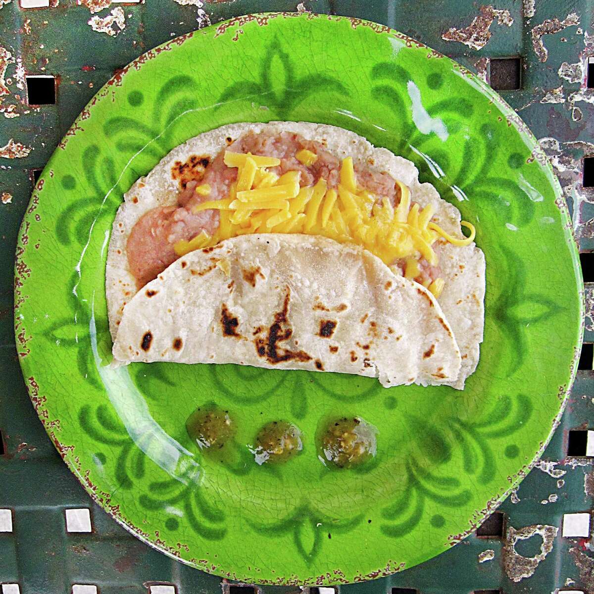 Bean and cheese taco on a handmade flour tortilla from Maria's Cafe on Nogalitos Street.