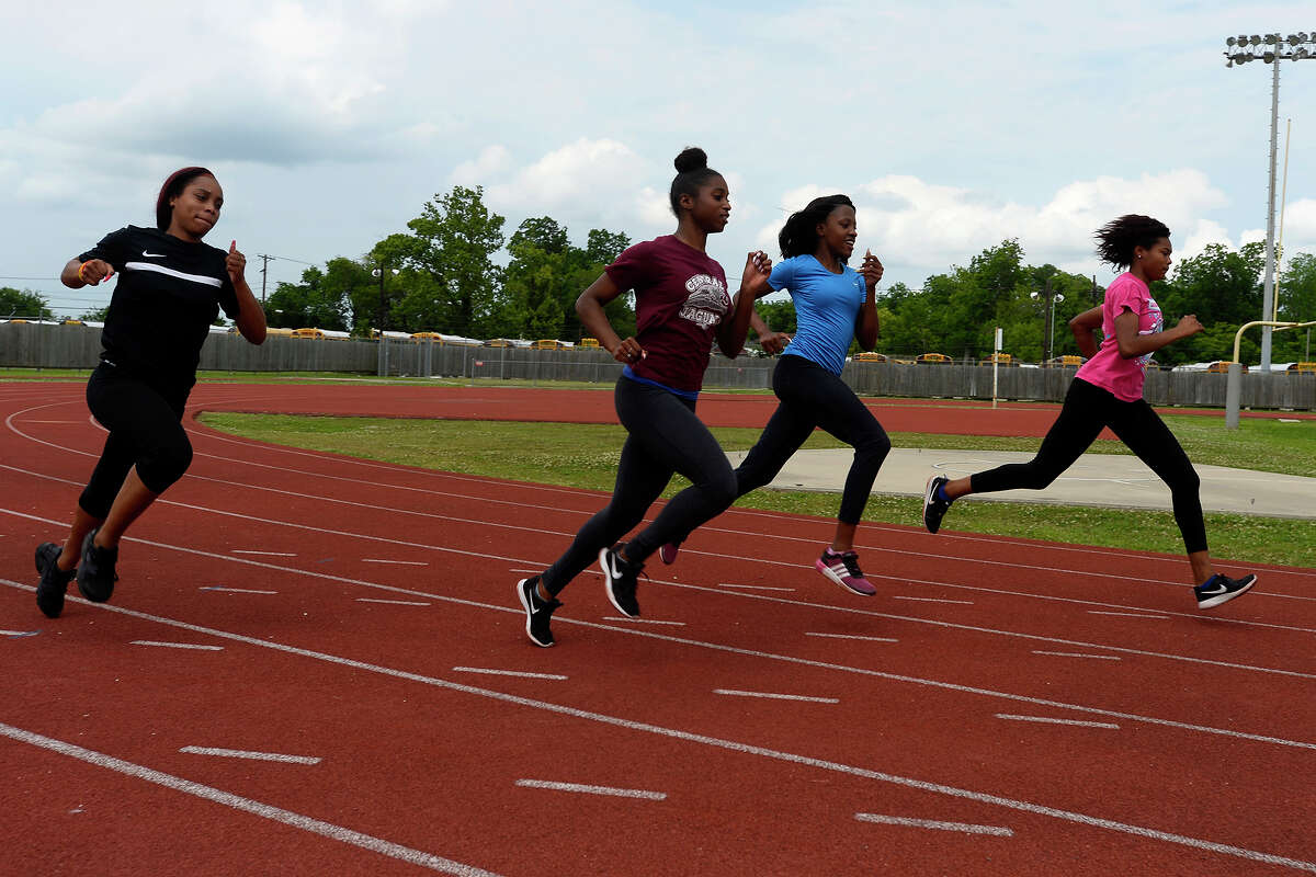 Marissa Savoy, Maya Kelly, Kayliah Carr and Briana Mouton of Central's girls 4x100 relay team warm up together during practice at Babe Zaharias Stadium on Tuesday afternoon. The team will compete in the state track meet in Austin. Photo taken Tuesday 5/9/17 Ryan Pelham/The Enterprise