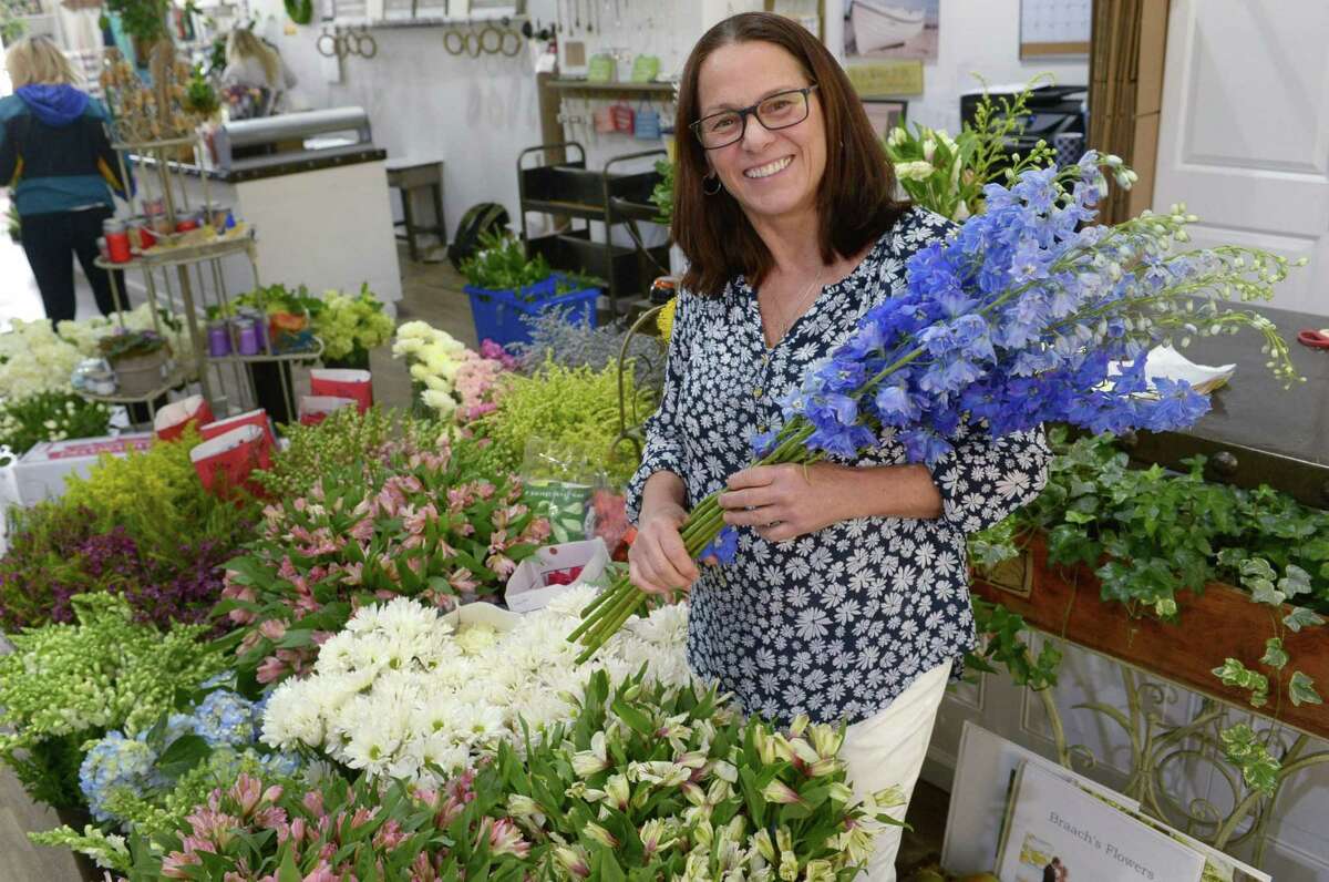 Owner Linda Vinci and her staff in the newly relocated Braach's Flowers Wednesday, May 10, 2017, ready the shop for Mother?’s Day in their shop in South Norwalk, Conn. The flower shop has had just three owners dating back to the Great Depression.