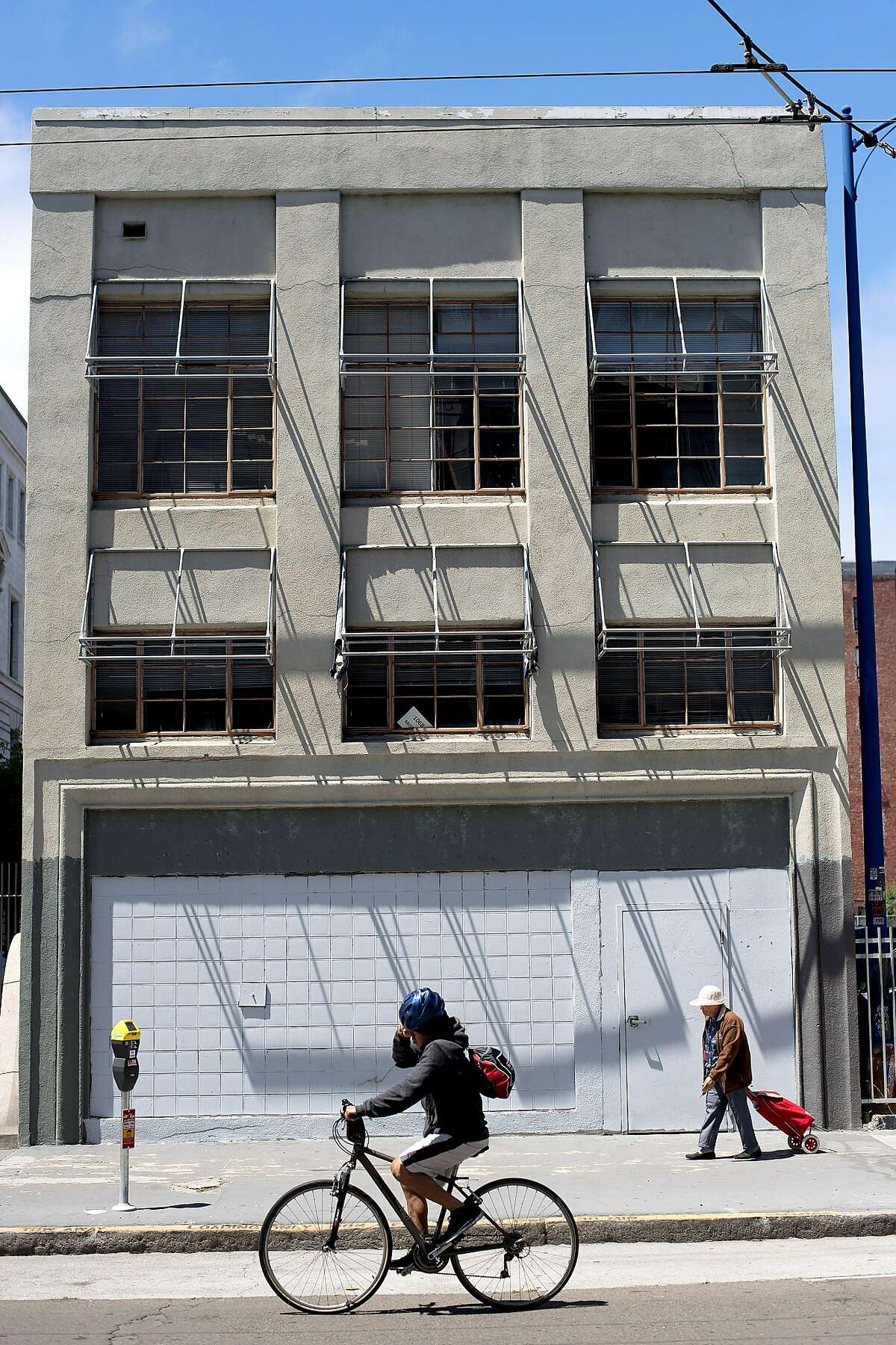 A biker passes 1068 Mission St. on Thursday, May 4, 2017, in San Francisco. The site is under consideration for affordable housing development.