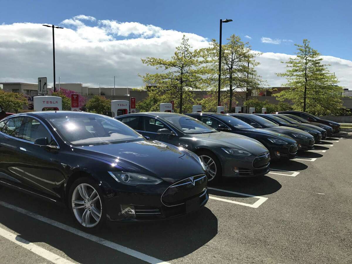 Tesla officials on Friday unveiled its new Supercharger station at the Connecticut Post mall in Milford, Conn.