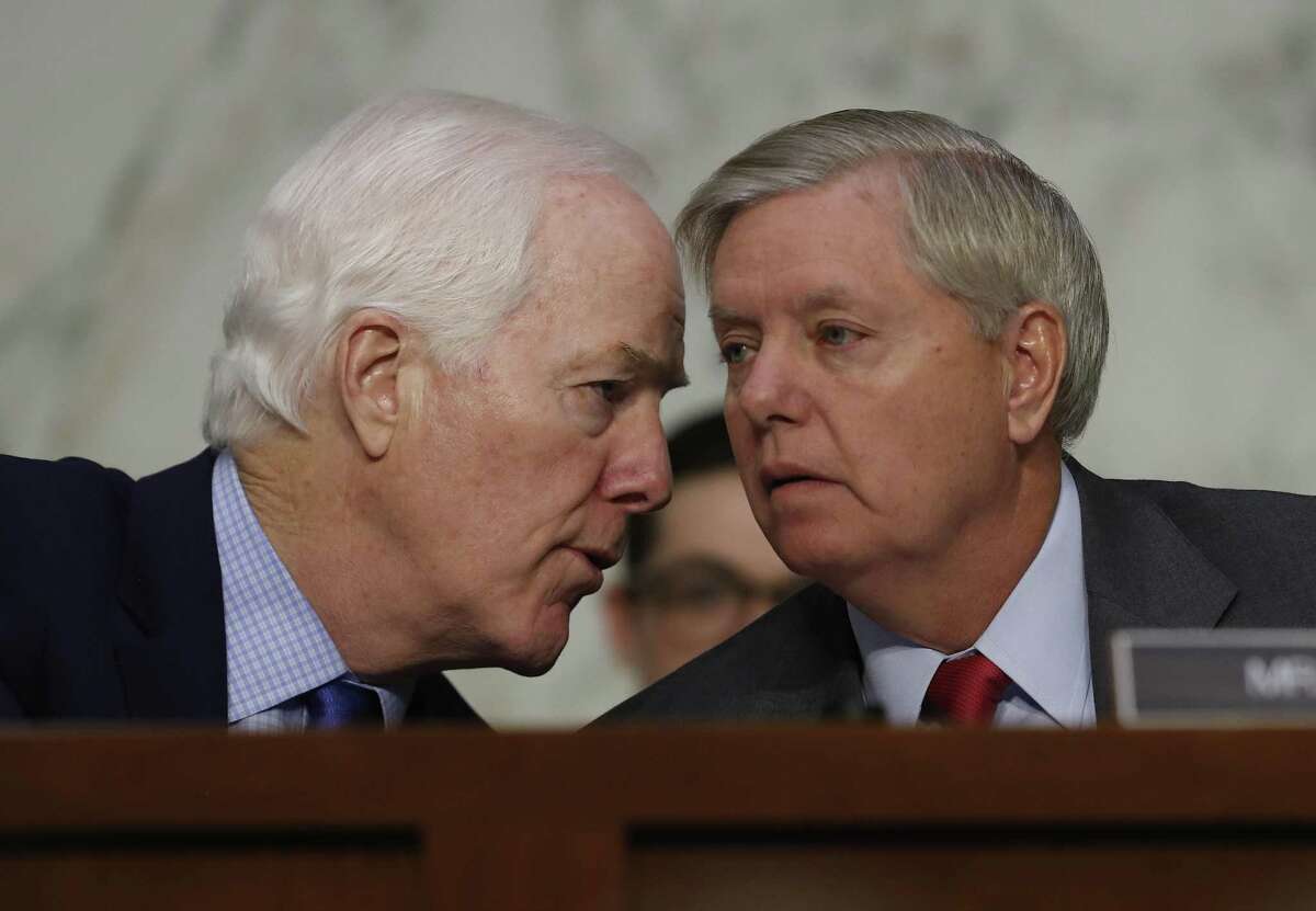 Senate Judiciary subcommittee on Crime and Terrorism Chairman Sen. Lindsey Graham, R-S.C., right, talks with Senate Majority Whip John Cornyn of Texas on Capitol Hill in Washington, Monday, May 8, 2017, during subcommittee's hearing: "Russian Interference in the 2016 United States Election." (AP Photo/Carolyn Kaster)
