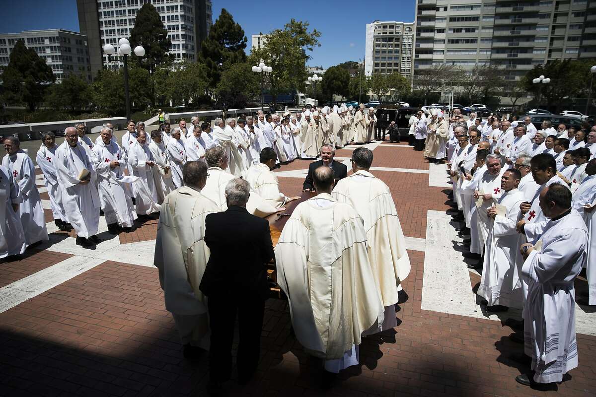 Priests line up outside Cathedral of Saint Mary of the Assumption as the casket of Archbishop George Niederauer, the eighth archbishop of San Francisco, is being escorted to an awaiting car after a Mass of Christian burial in San Francisco, Calif. on Friday, May 12, 2017.
