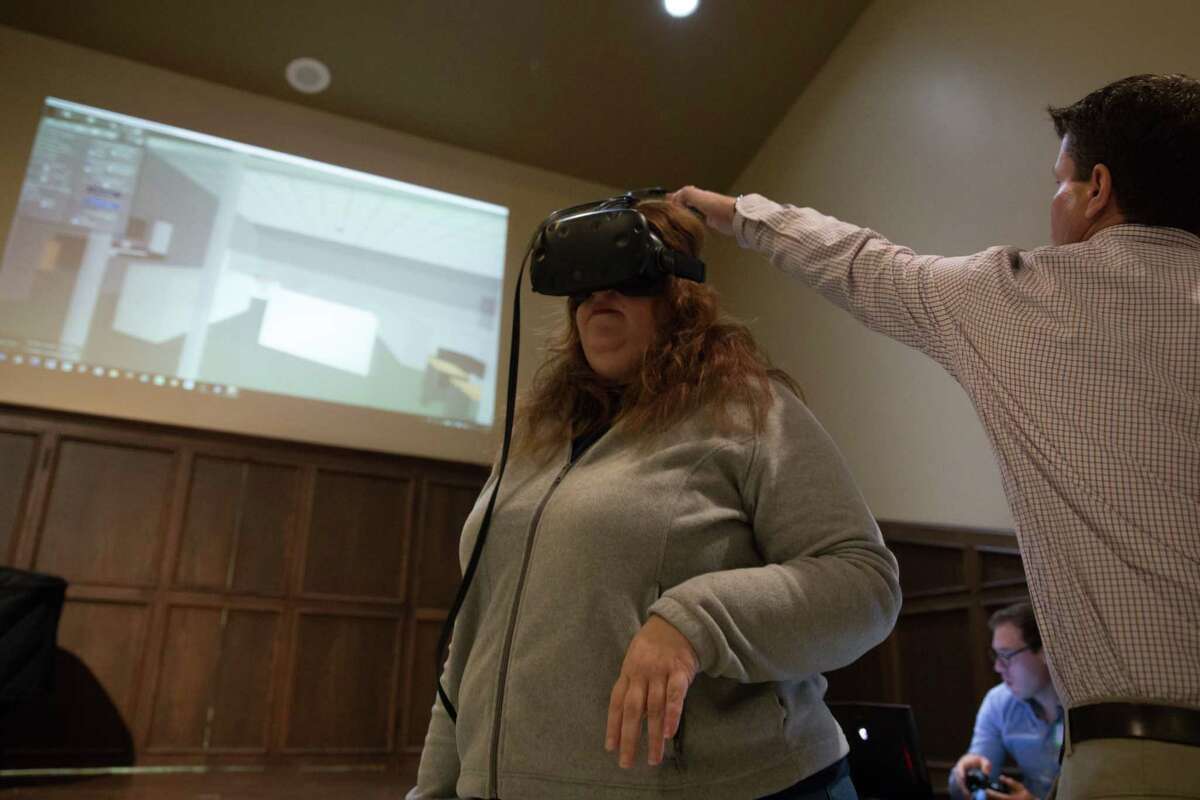 A teacher sees a virtual reality image of the new High School for the Performing and Visual Arts, presented by McCarthy Building Cos.