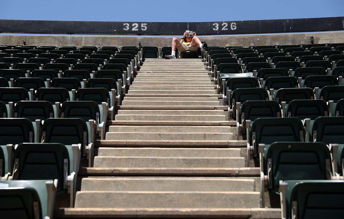 Oakland Athletics' fan Santiago Musgrove of Los Gatos relaxes in upper deck during A;s 8-6 win over Detroit Tigers during MLB game at Oakland Coliseum in Oakland, Calif., on Sunday, May 7, 2017.
