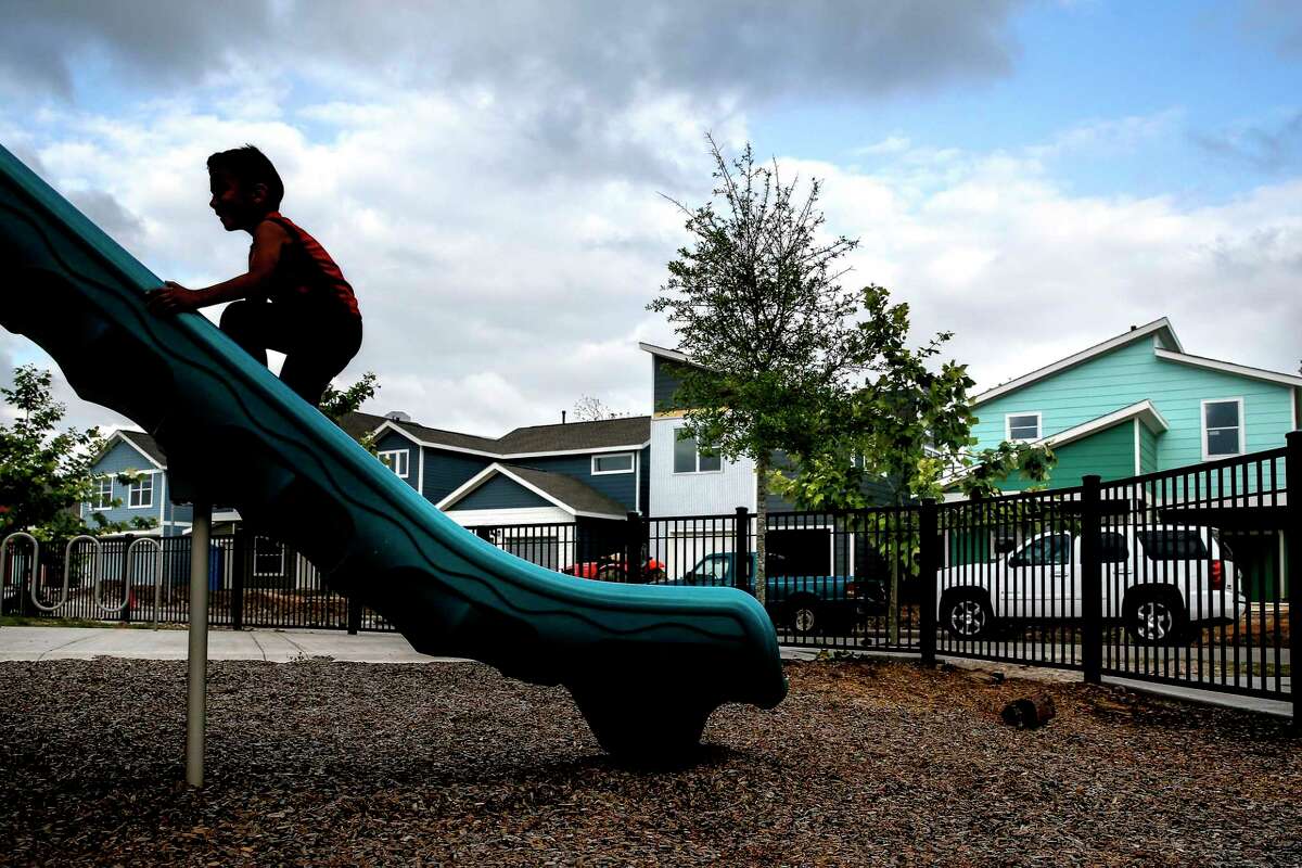 Damian Amya, 6, climbs up a slide while playing tag with his brother at a park in the Avenue Place affordable housing neighborhood Tuesday, April 25, 2017 in Houston. The city has wasted, misspent or lost track of tens of millions of affordable housing dollars over the last decade. ( Michael Ciaglo / Houston Chronicle)