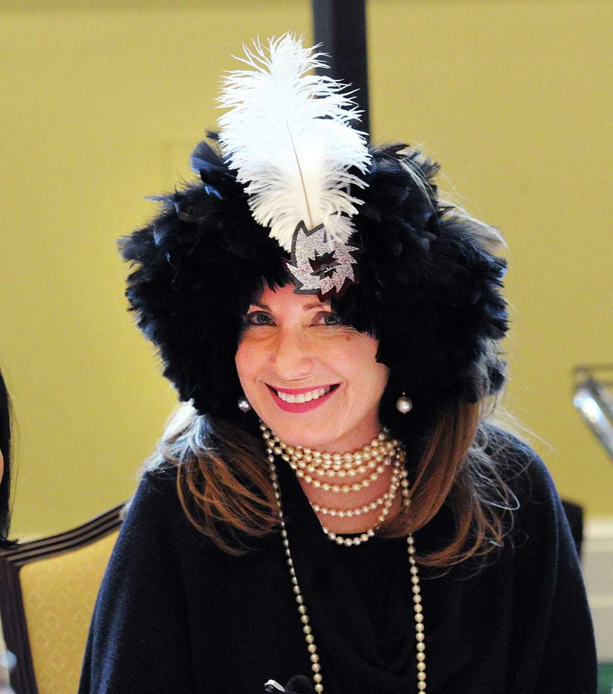 Victoria Sybelnik of Stirling Health Care wore a fortune-teller costume during the Murder Mystery Dinner at the First Presbyterian Chruch in Greenwich, Conn., Thursday, May 11, 2017. As part of the celebration of older Americans Month, the Greenwich Senior Center hosted a mafia-themed murder mystery dinner.