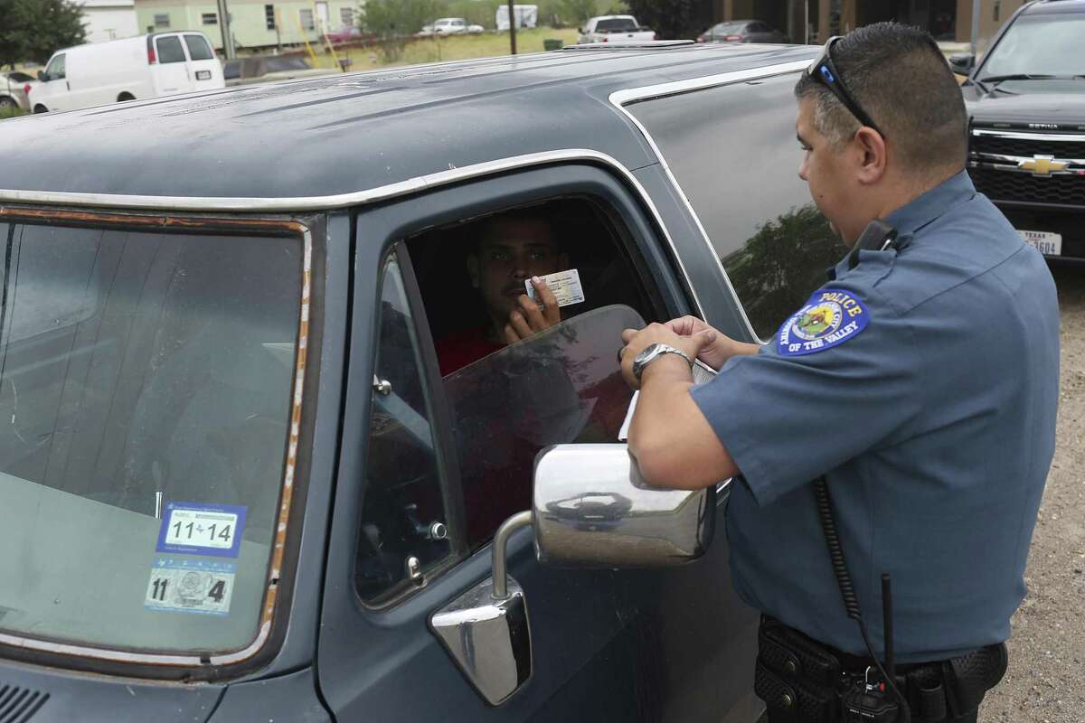 Rio Grande City Assistant Police Chief Joey Solis, 33, talks with a man he pulled over for driving with an expired registration sticker, Thursday, May 11, 2017. Solis said that unless is a serious crime, most department officers rarely asked for the citizenship of people they interact with throughout their shifts.