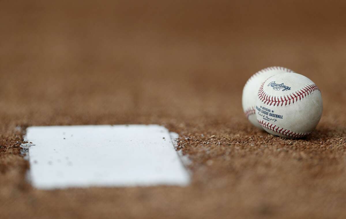 Baseballs sit near the pitching rubber on the ten pack awaiting pitchers during spring training at The Ballpark of the Palm Beaches, in West Palm Beach, Florida, Thursday, February 16, 2017. ( Karen Warren / Houston Chronicle )