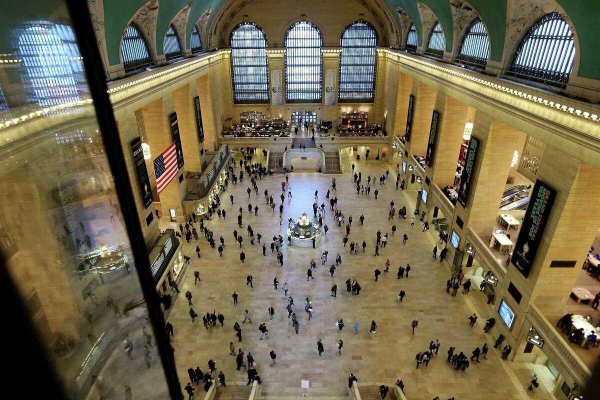 NEW YORK, NY - JANUARY 31: People walk through Grand Central Terminal on January 31, 2013 in New York City. The terminal opened in 1913 and is the world's largest terminal covering 49 acres with 33 miles of track. (Photo by Mario Tama/Getty Images)