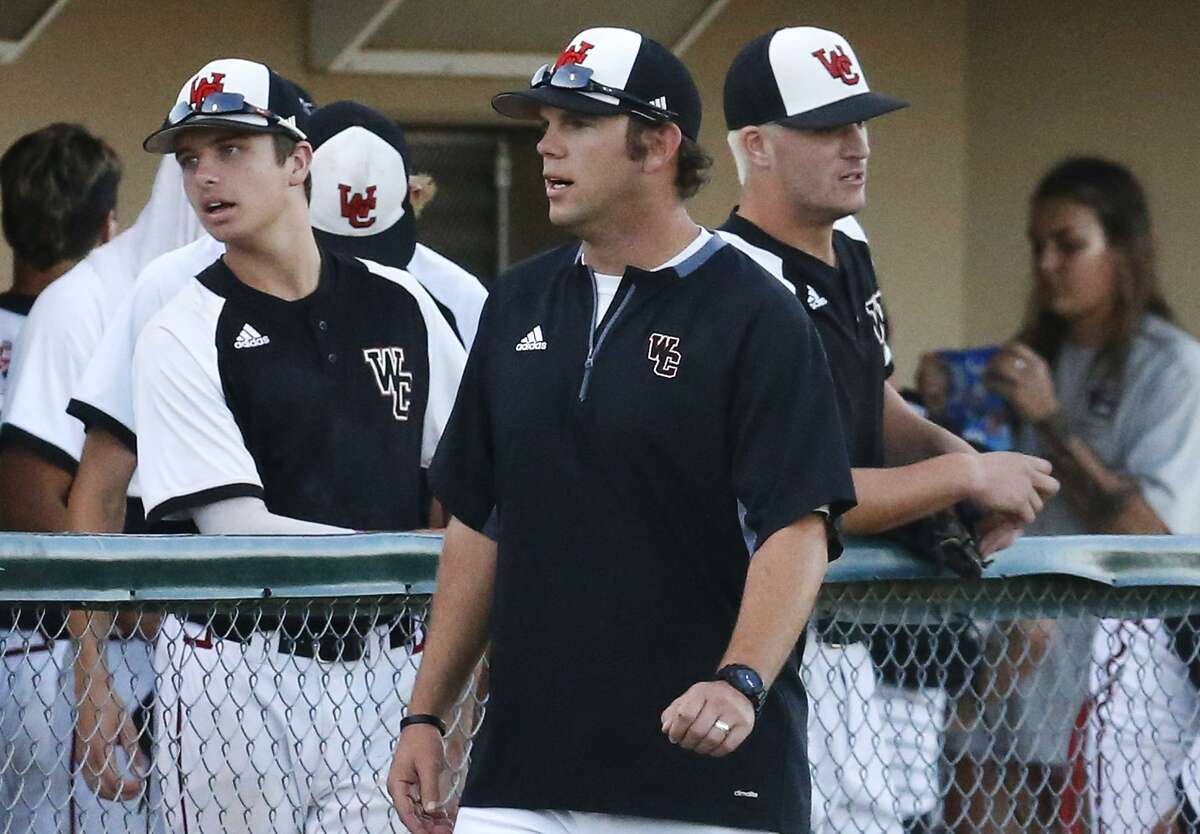 Churchill coach Alan Hill talks to his team in the dugout during a Class 6A second-round playoff game against Clemens at Blossom Athletic Center on May 12, 2017.