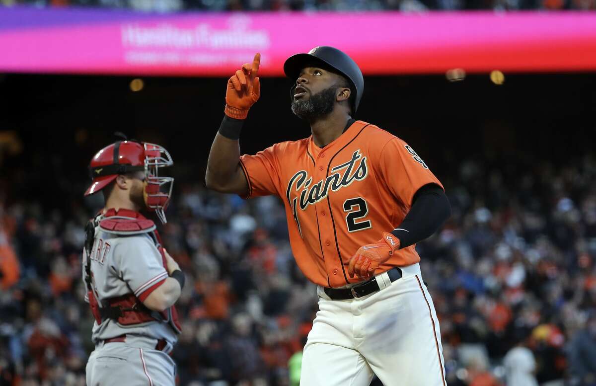 San Francisco Giants' Denard Span (2) points skyward as he crosses home plate following a solo home run against the Cincinnati Reds during the first inning of a baseball game Friday, May 12, 2017, in San Francisco. (AP Photo/Marcio Jose Sanchez)