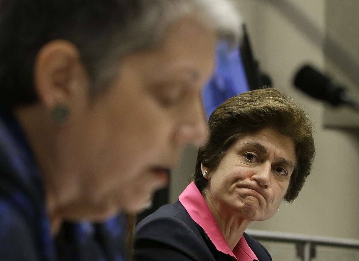 State Auditor Elaine Howle, right, looks over at University of California President Jane Napolitano reads her statement concerning the audit conducted by Howle's office, during a hearing of the Joint Legislative Audit Committee, Tuesday, May 2, 2017, in Sacramento, Calif. Lawmakers questioned Napolitano about the audit that found that UC administrators hid $175 million from the public while the university system raised tuition and asked lawmakers for more money. Napolitano has disputed the audit's findings.(AP Photo/Rich Pedroncelli)