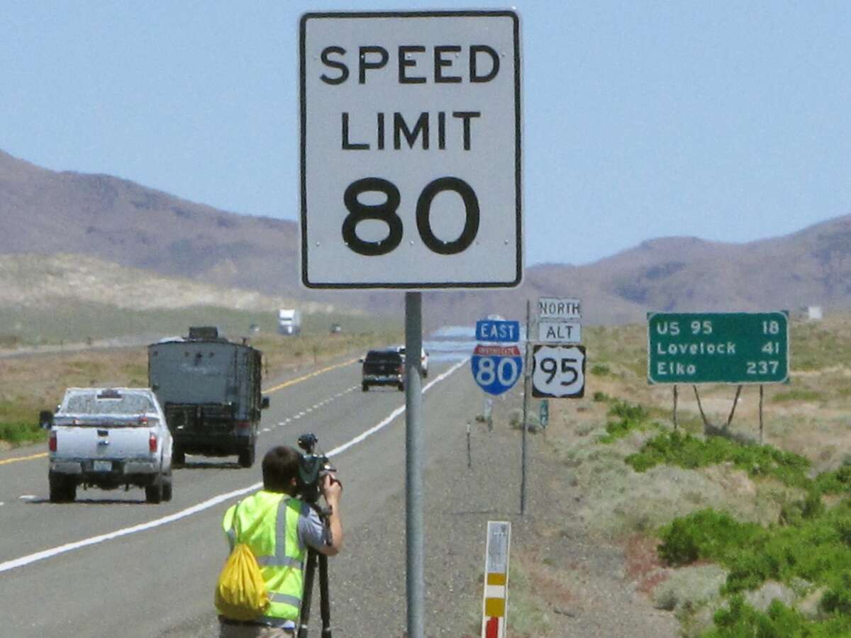 One of the new 80 mph speed limit signs posted Monday, May 8, 2017, along U.S. Interstate 80 east near Fernley, Nev., signals the faster speed allowed on a 130-mile stretch from east of Reno to the rural town of Winnemucca. Nevada joins South Dakota, Wyoming, Montana, Idaho, Utah and Texas as the only states that now allow speeds in excess of 75 mph on parts of rural highways and interstates. (AP Photo/Scott Sonner)