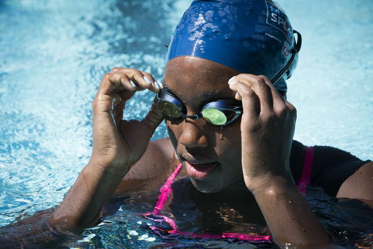 2016 Rio Olympics gold medalist, Simone Manuel adjusts her goggles during a visit to Houston to give swim lessons to children at the Dad's Club, Saturday, May 13, 2017, in Houston. ( Marie D. De Jesus / Houston Chronicle )