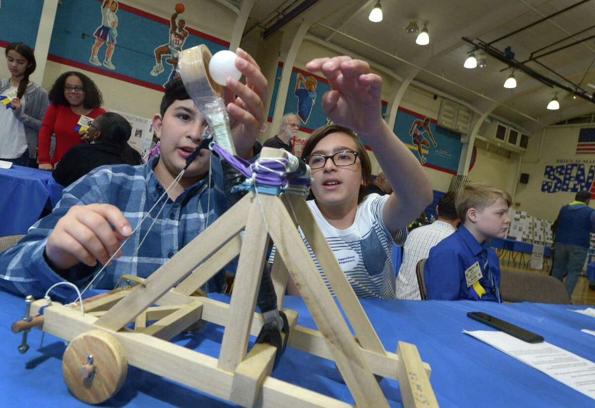 Ponus Ridge Middle School 6th graders Favian Quiroga and Gabriel Halatchev demonstrate their catapult project during the Norwalk Public Schools 2017 STEM Expo Saturday, May 13, 2017, at Brien McMahon High School in Norwalk, Conn. The Expo featured student winners from each school presenting their STEM projects, high school STEM demonstrations, and PreK students from Odyssey and ELLI classrooms presenting their individual STEM-based projects.