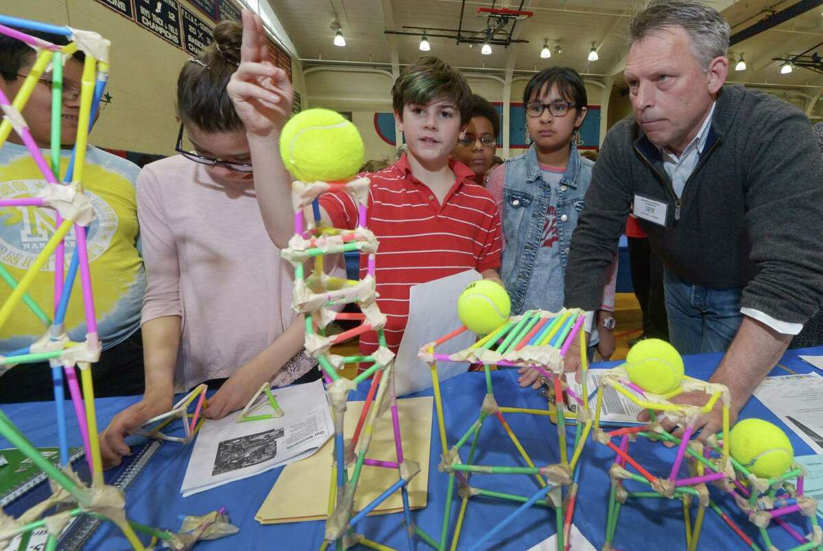 Naramake Elementary School 5th graders Jose Ruiz, Maria Roque, Sean Tagarielo, Jaylen Myles and Danielle Erive discuss their STEM Tower Challenge with judge Anthony Allison during the Norwalk Public Schools 2017 STEM Expo Saturday, May 13, 2017, at Brien McMahon High School in Norwalk, Conn. The Expo featured student winners from each school presenting their STEM projects, high school STEM demonstrations, and PreK students from Odyssey and ELLI classrooms presenting their individual STEM-based projects.