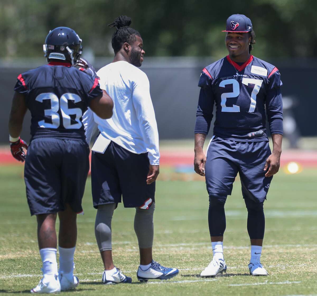 D'Onta Foreman (right) prepares to run through drills during Texans rookie camp at NRG practice field Saturday, May 13, 2017, in Houston. ( Steve Gonzales / Houston Chronicle )