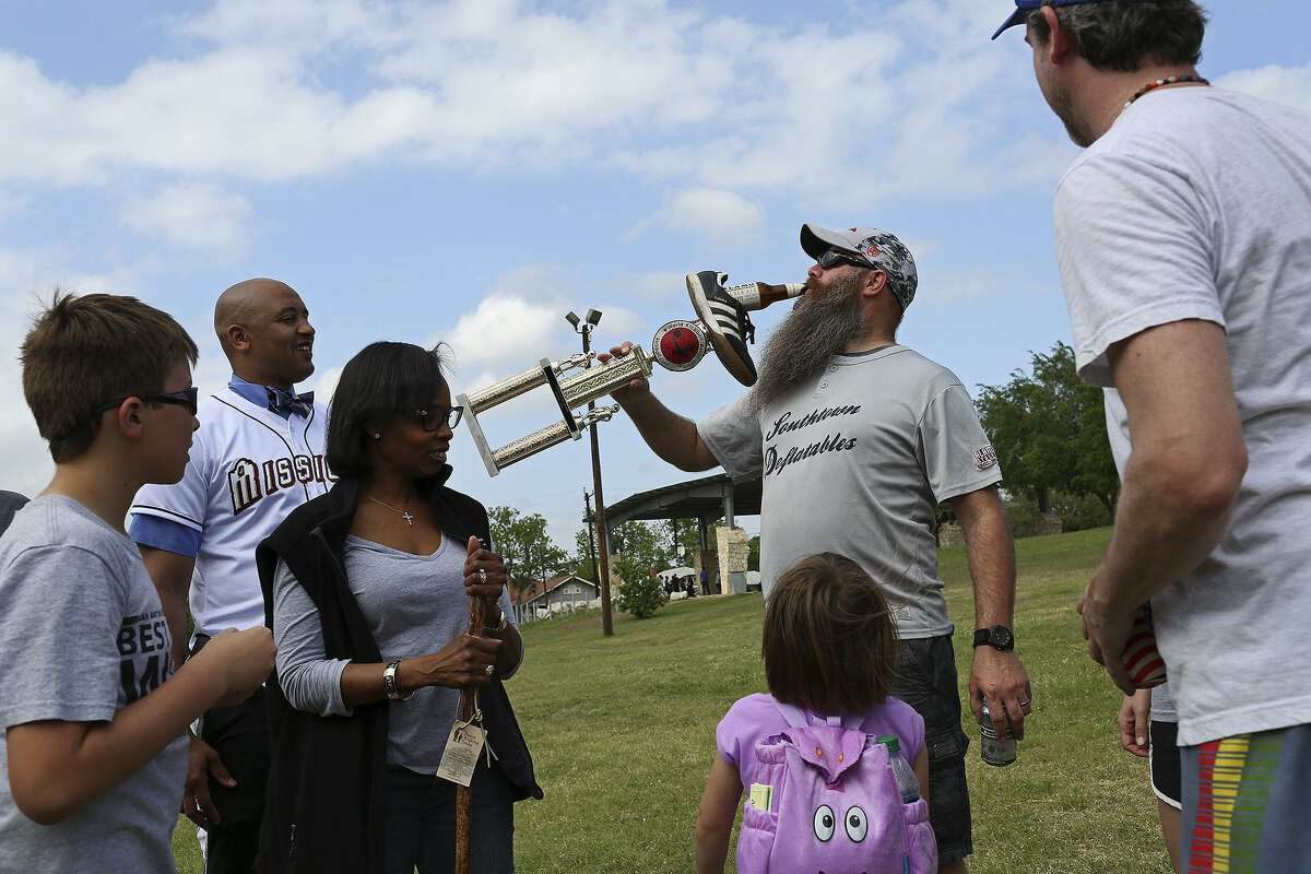 The Dignowity Hill neighborhood, where Mayor Ivy Taylor (third from left) lives, is undergoing rapid redevelopment and drawing newcomers. The mayor attended a kickball game in April 2106 at Lockwood Park in the neighborhood.