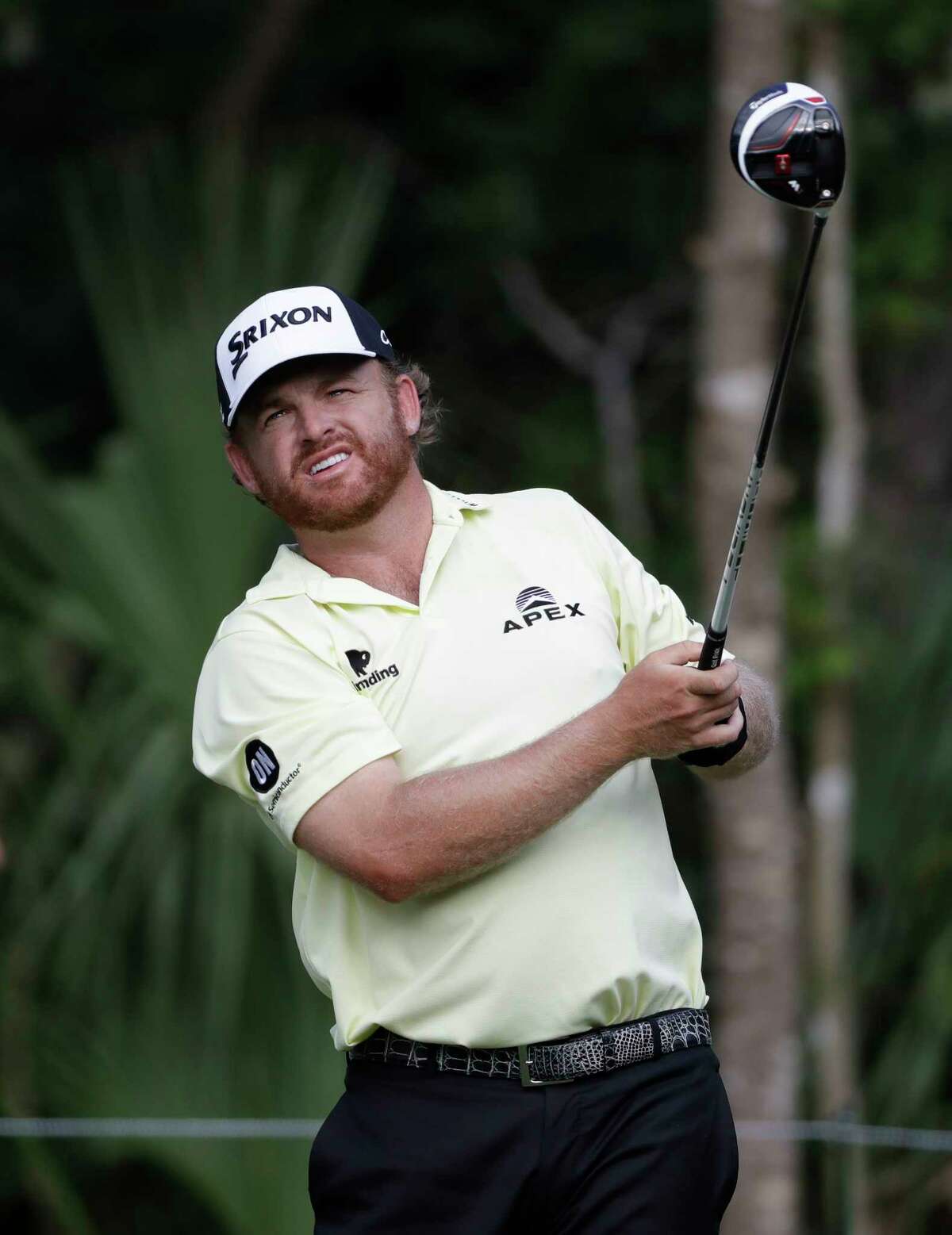 J.B. Holmes watches his shot from the 15th tee during the third round of The Players Championship golf tournament Saturday, May 13, 2017, in Ponte Vedra Beach, Fla. (AP Photo/Chris O'Meara)