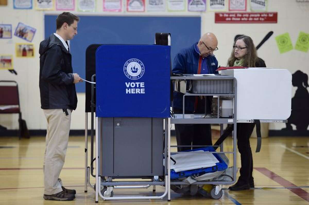 Voting was described as slow but steady at Guilderland Elementary School on Tuesday, the day that voters around the state headed to the polls to vote on their school district's budget and picks for school board. (Skip Dickstein / Times Union)