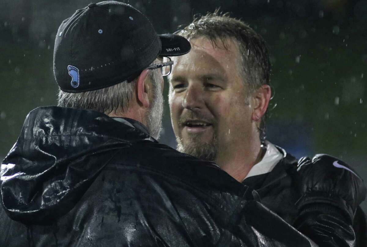 Tar Heel coach Joe Breschi congratulates friend and UlAlbany coach Scott Marr on his team's victory in the first round of the NCAA Div 1 Men's Lacrosse Championship Saturday, May 13, 2017 at UAlbany's Casey Stadium. (Ed Burke photo - Special to The Times Union)