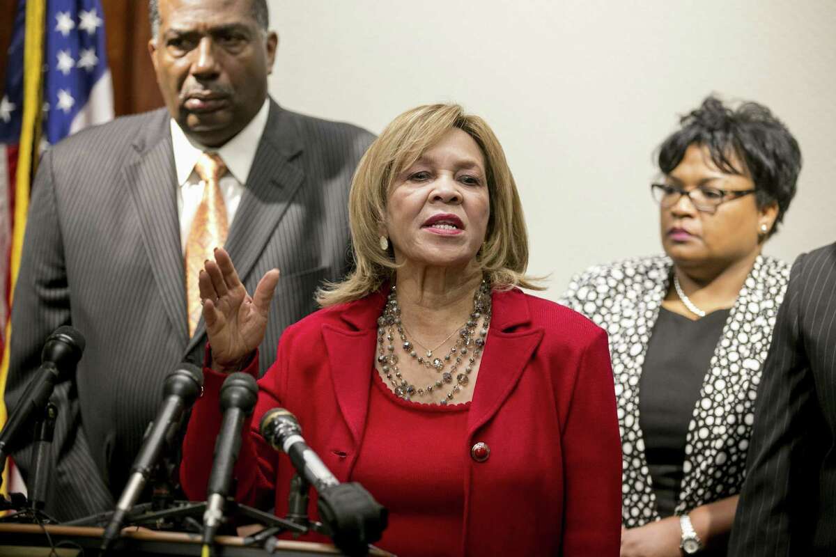 State Rep. Helen Giddings (center), D-DeSoto, shown speaking at a May news conference, announced Tuesday she will retire at the end of her term.