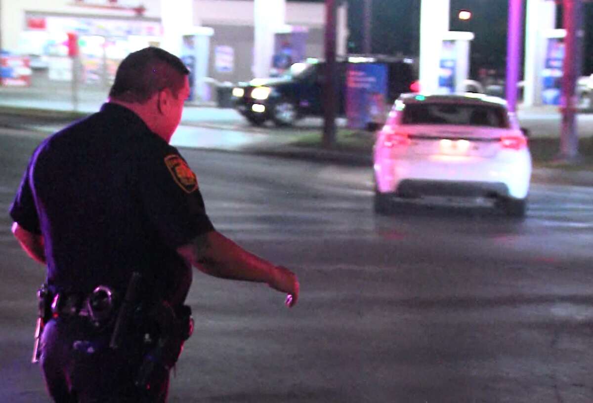 San Antonio police say an officer was dragged by a vehicle fleeing the scene of a suspected burglary on the far Northwest Side Saturday night, May 14, 2017.