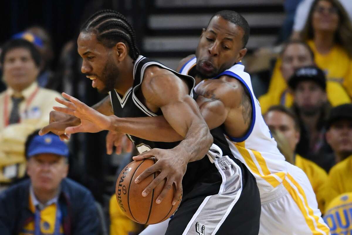 OAKLAND, CA - MAY 14: Andre Iguodala #9 of the Golden State Warriors defends against Kawhi Leonard #2 of the San Antonio Spurs during Game One of the NBA Western Conference Finals at ORACLE Arena on May 14, 2017 in Oakland, California. NOTE TO USER: User expressly acknowledges and agrees that, by downloading and or using this photograph, User is consenting to the terms and conditions of the Getty Images License Agreement. (Photo by Thearon W. Henderson/Getty Images)