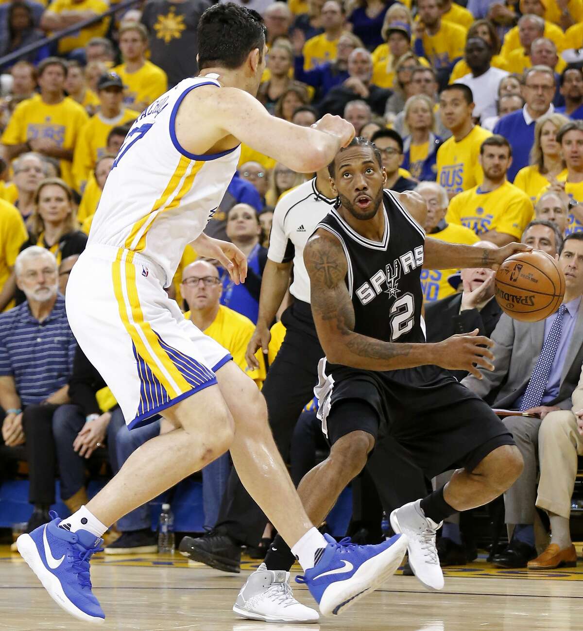 San Antonio Spurs' Kawhi Leonard looks for room against Golden State Warriors' Zaza Pachulia during second half action of Game 1 in the Western Conference Finals held Sunday May 14, 2017 at Oracle Arena in Oakland, CA. Leonard was injured on a play. The Warriors won 113-111.