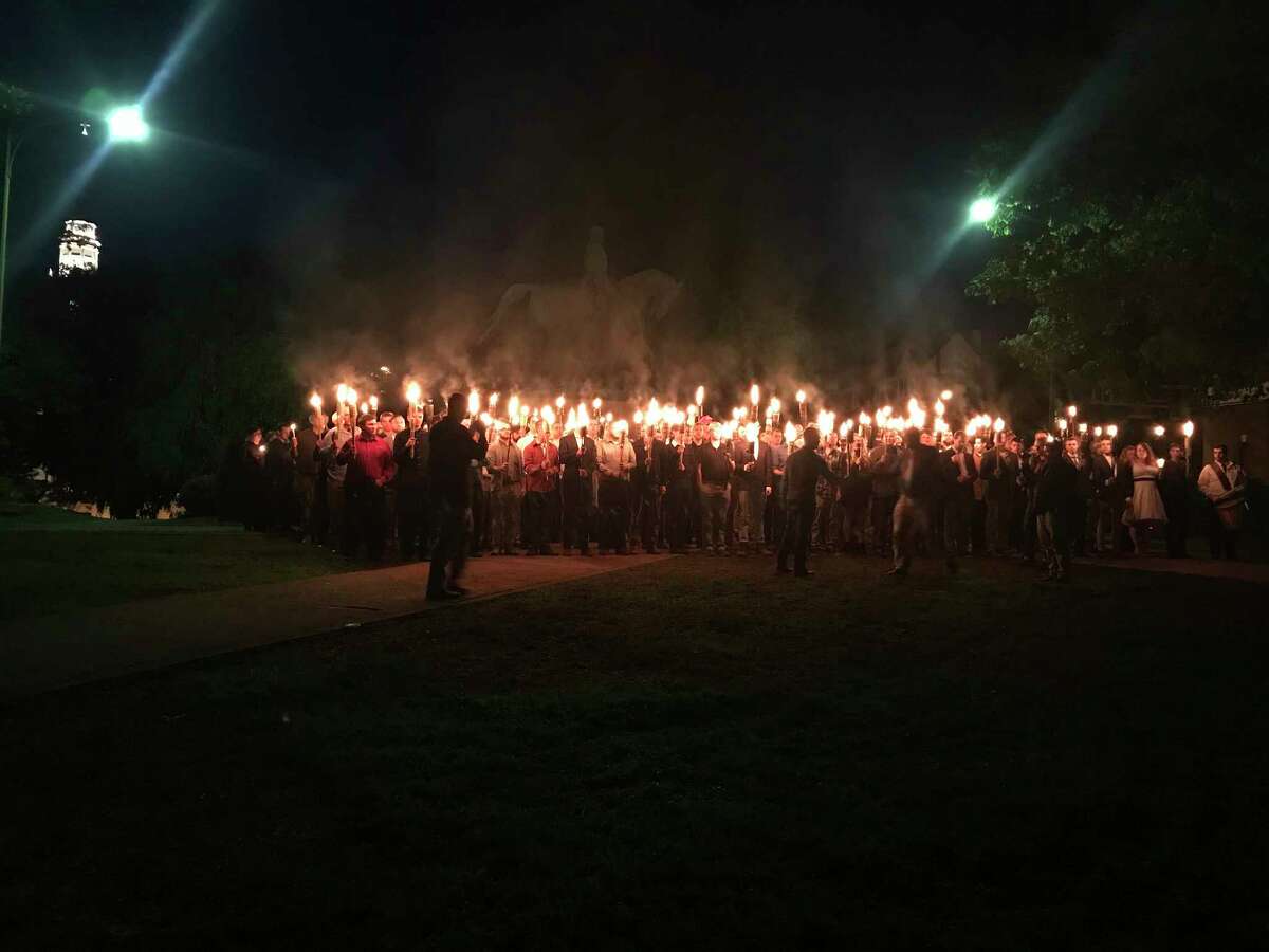 The Charlottesville mayor condemned the protest as reminiscent of the KKK.